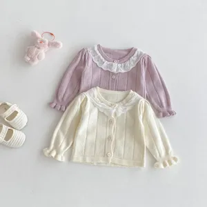 Baby girls knit cardigan with lace collar, sweet toddler fall outerwear detail view.
