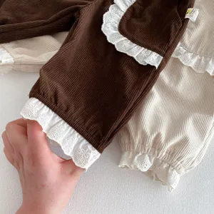 Toddler girls corduroy pants fabric detail, soft brown and beige with white lace ruffle cuff