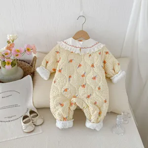 Baby quilted winter jumpsuit with cute floral print and delicate white lace collar.