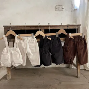 Details of baby corduroy pants and overalls in multiple colors, featuring vintage retro style.