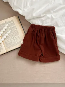 Infant toddler brown corduroy casual shorts detail shot, comfortable elastic waist design.