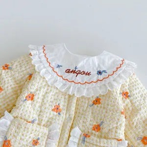 Cute baby girls quilted winter jacket with lace collar and floral print for toddlers.