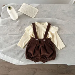 Infant baby girl corduroy suspender shorts set with ruffle lace long sleeve top detail view.