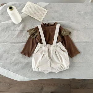 Baby corduroy suspender shorts and ribbed long sleeve top set for infants detail view.