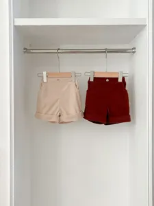 Infant corduroy casual shorts details, cute solid color baby trousers for spring everyday wear.