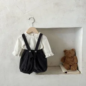 Infant baby corduroy overalls set detail, vintage minimalist style blouse and pants.