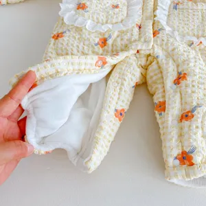 Detailed view of baby winter padded romper with plush lining and cute floral pattern design.
