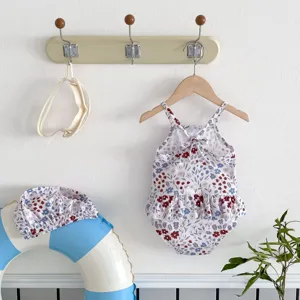 Toddler floral print one-piece swimsuit detail view, cute baby summer swimwear set.