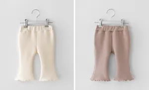 Kids cotton flare pants with ruffle hem, comfortable elastic waist, stylish solid colors.