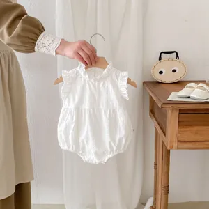 Infant white sleeveless baby romper detail, cute stand collar and soft cotton fabric.