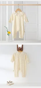 Infant baby girl floral long sleeve romper detailed view with sweet frilly collar design.
