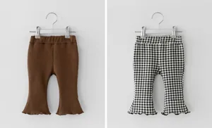 Detail shot of toddler ribbed flare pants featuring solid brown and classic black white plaid styles.