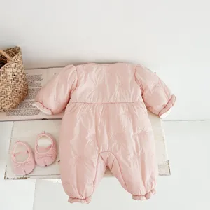 Pink quilted baby romper with cute bow embroidery details, cozy winter newborn outfit.