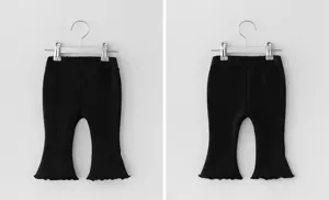 Black flare pants for girls with cute lettuce edge hem and elastic waist, comfortable fit.
