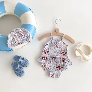 Cute toddler girls floral print one piece swimsuit set with matching swim cap, sandals and goggles.