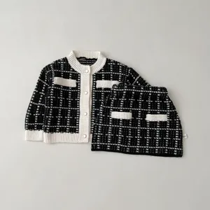 Baby girls black white knit tweed cardigan and skirt set, elegant toddler outfit.