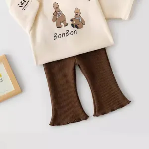 Kids casual outfit set with cartoon bear top and brown ribbed flared pants for toddler girls.