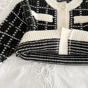 Toddler baby black white tweed knit cardigan detail, classic elegant style jacket.