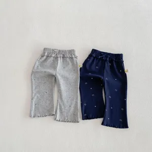 Pantalon patte d'eph en coton pour bébé avec de jolis imprimés smiley et détails de nœud.