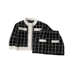 Black and white knit cardigan and skirt set for toddler girls, chic two-piece outfit.