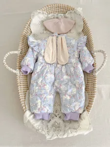 Cute baby winter fleece-lined romper with bunny ears and matching hat for little girls.