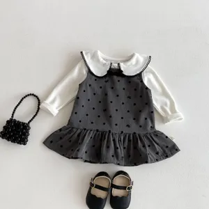 Baby girl polka dot dress set long sleeve top and ruffle jumper dress detail view.