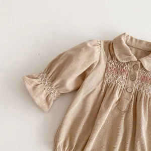 Cute baby girl corduroy romper dress with delicate smocking embroidery and sweet doll collar style.