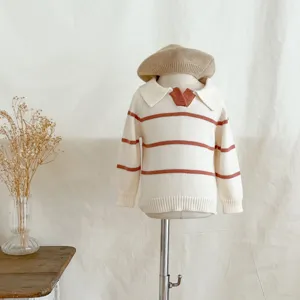 Close-up view of toddler knit sweater detail, featuring lapel collar and chic stripes for baby.