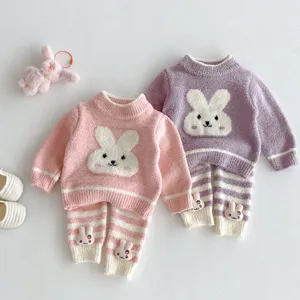 Infant winter fleece pajama set featuring cute bunny motifs, soft fabric, warm two-piece loungewear.
