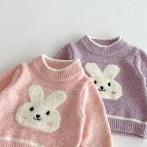 Cozy plush rabbit baby autumn sweater, soft coral fleece infant warm top close-up detail.