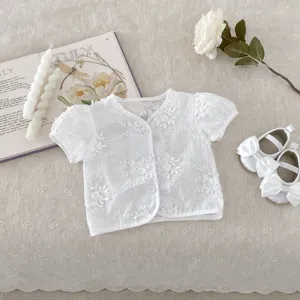 White baby girl short-sleeve embroidered cardigan detail showing delicate cut-flower floral pattern