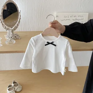 Charming kids white long sleeve ribbed t-shirt with a cute black bow detail. Perfect for daily wear.