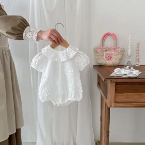 Charming baby girl summer short sleeve romper detail, delicate embroidered doll collar design.