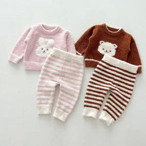 Soft fleece baby loungewear set detail featuring cute rabbit and bear designs for everyday wear.