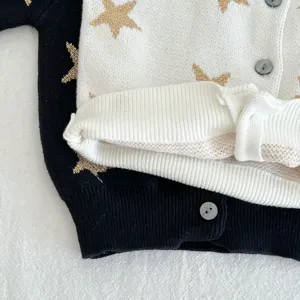 Baby infant knitted cardigan detail shot, soft cotton long sleeve star print sweater coat.