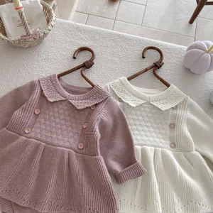 Baby girl knitted romper dress detail shot, cute lapel long sleeve infant knitwear jumpsuit.