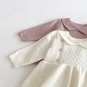 Baby knit long sleeve romper detail, soft cotton blend material, cute ruffles and buttons.