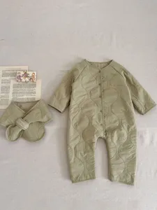Quilted baby fleece jumpsuit detail, soft cozy winter infant snowsuit with cute bib.