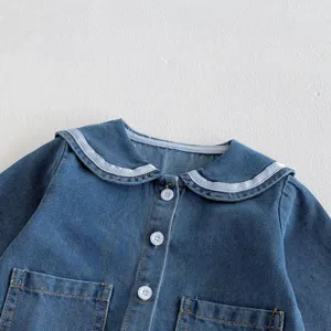 Infant baby girl soft denim jacket detail view, cute sailor collar and white buttons design.
