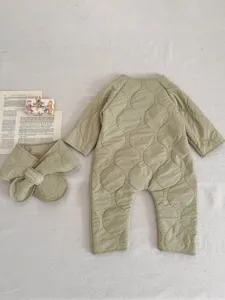 Detailed view of the winter thickened warm baby romper and matching scarf in light green.