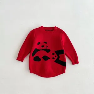 Detailed view of baby red knit romper featuring a cute black cartoon panda pattern, soft fabric.