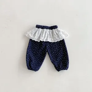 Toddler floral leggings with white lace frill, cute baby pants detail shot for autumn wear.