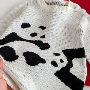 Infant baby knitted romper detail, cute panda pattern knitwear, soft winter baby clothes.