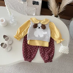 Cute baby girl autumn outfit set with cute puppy knit vest and floral long pants detail.