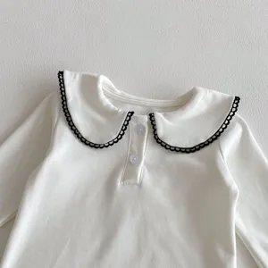 Baby white long sleeve top detail, sweet black scalloped collar, cute button placket design.