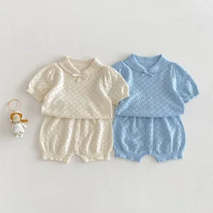 Detailed view of infant knit short sleeve and shorts set, hollow-out design for summer wear.