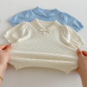 Infant knit short-sleeve top with doll collar and cute bow design, breathable hollow-out texture.