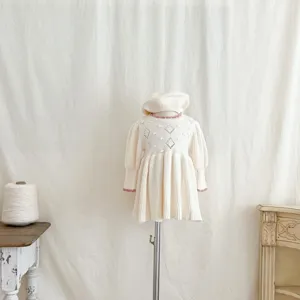 Details of the cute baby girl knitted dress and beret set, warm long sleeve winter outfit.