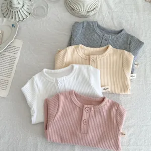 Ribbed cotton baby long sleeve T-shirt detail, soft knit fabric with cute button collar design.