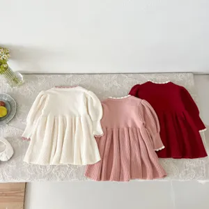 Detailed view of three-color toddler knit dresses featuring cute ruffle collars and pleats.
